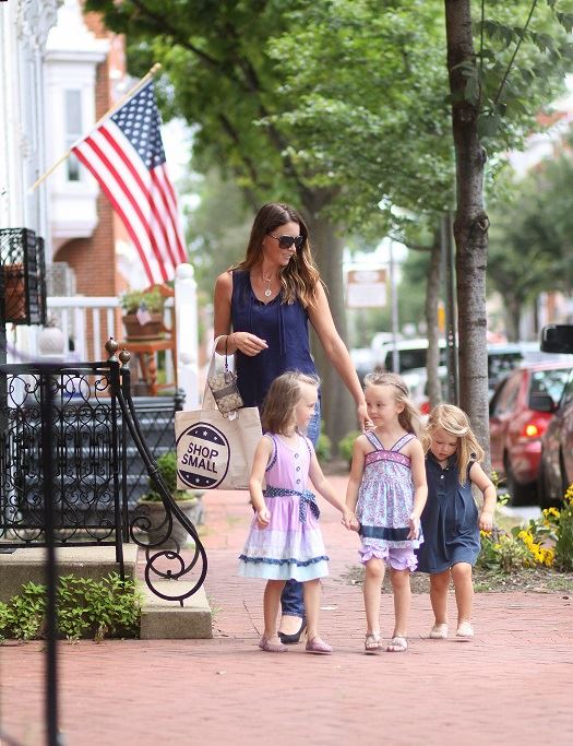 Mom walking with her 3 daughters