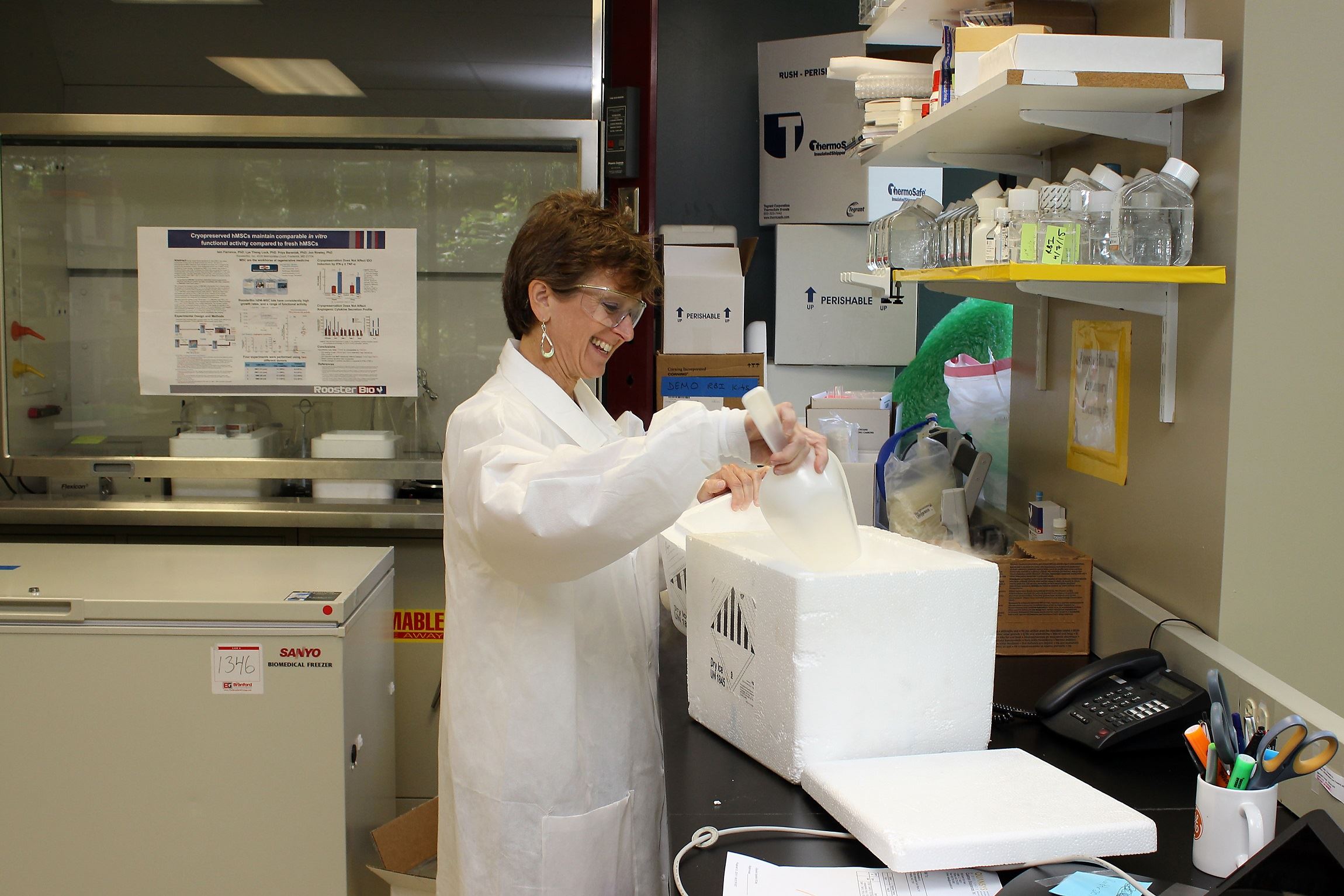 Scientist with scoop and cooler